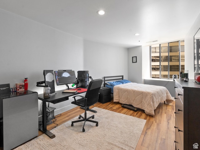 48 W 300 S Unit 1203N, Salt Lake City, UT 84101 - bedroom with wood finished floors, a desk, and recessed lighting