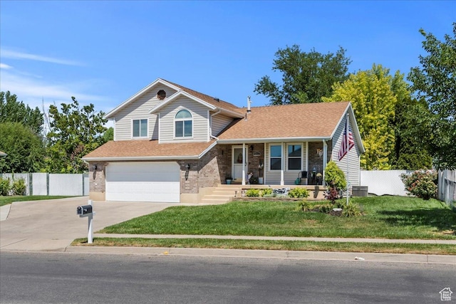 4266 S 2900 W, Roy, UT 84067 - view of front of house with concrete driveway, an attached garage, a porch, brick siding, and roof with shingles