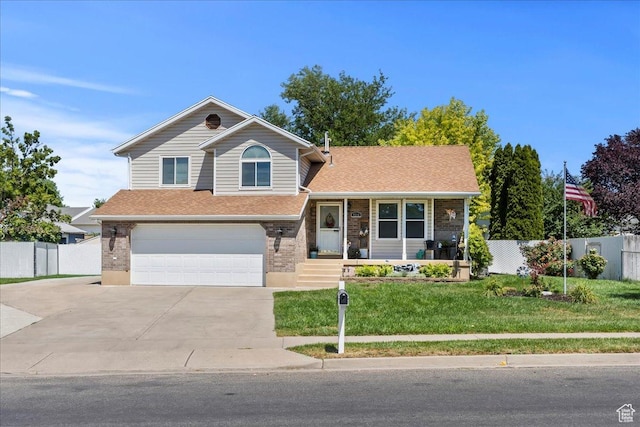 4266 S 2900 W, Roy, UT 84067 - split level home with concrete driveway, an attached garage, covered porch, a shingled roof, and brick siding