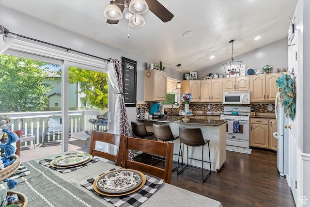 4266 S 2900 W, Roy, UT 84067 - kitchen with white appliances, decorative backsplash, ceiling fan, a peninsula, and lofted ceiling