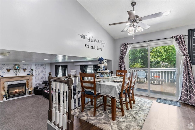 4266 S 2900 W, Roy, UT 84067 - dining area featuring a ceiling fan, a fireplace, high vaulted ceiling, and wood finished floors