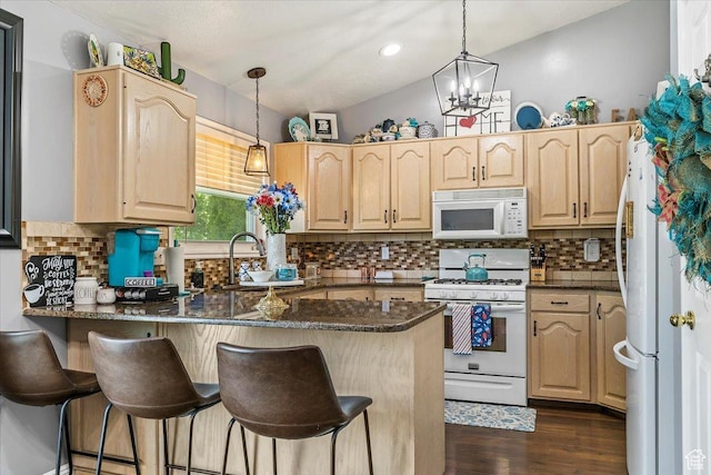 4266 S 2900 W, Roy, UT 84067 - kitchen featuring white appliances, a peninsula, light brown cabinets, a breakfast bar area, and decorative backsplash