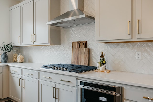 5976 N Canyon Rim Rd E Unit 615, Lehi, UT 84043 - kitchen with wall chimney range hood, appliances with stainless steel finishes, and backsplash