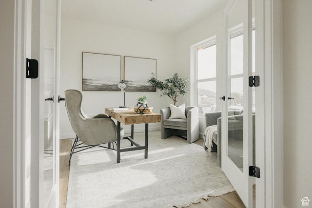 5976 N Canyon Rim Rd E Unit 615, Lehi, UT 84043 - sitting room featuring french doors, light wood finished floors, and a desk