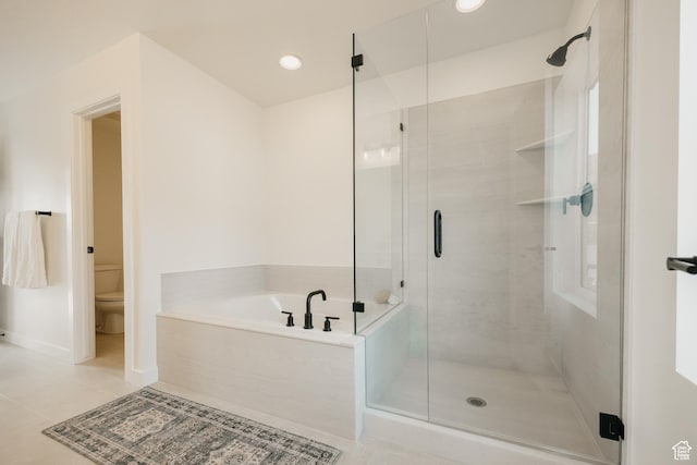 5976 N Canyon Rim Rd E Unit 615, Lehi, UT 84043 - bathroom featuring tile patterned floors, a bath, and a stall shower
