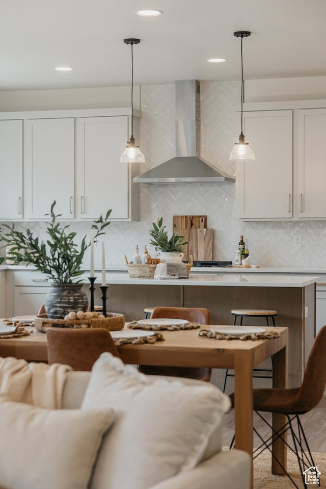 5976 N Canyon Rim Rd E Unit 615, Lehi, UT 84043 - kitchen featuring wall chimney exhaust hood, pendant lighting, tasteful backsplash, white cabinets, and recessed lighting