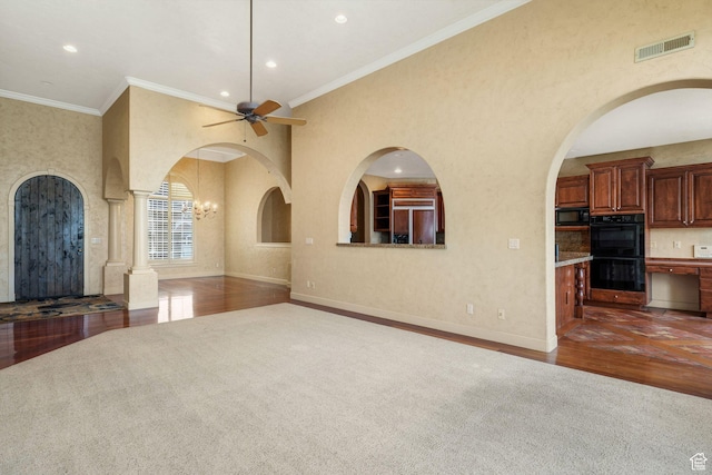 238 N Vista Ct, Saratoga Springs, UT 84045 - unfurnished living room with dark colored carpet, a ceiling fan, recessed lighting, arched walkways, and dark wood-style floors
