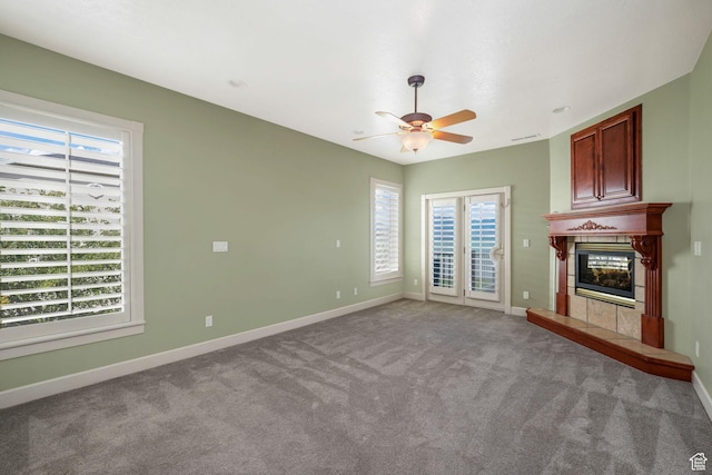 238 N Vista Ct, Saratoga Springs, UT 84045 - unfurnished living room with healthy amount of natural light, a fireplace, carpet, and a ceiling fan