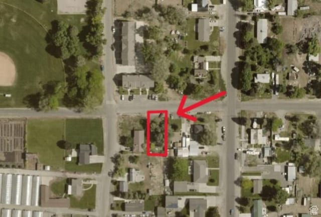247 W 200 S, Santaquin, UT 84655 - aerial view of property and surrounding area with property parcel outlined and nearby suburban area