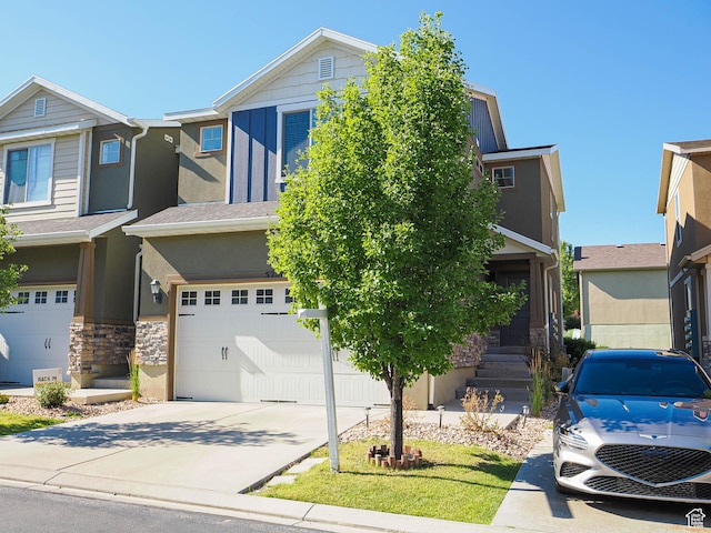 5229 W Armada Way, Herriman, UT 84096 - view of front of property featuring stucco siding, a garage, stone siding, and concrete driveway