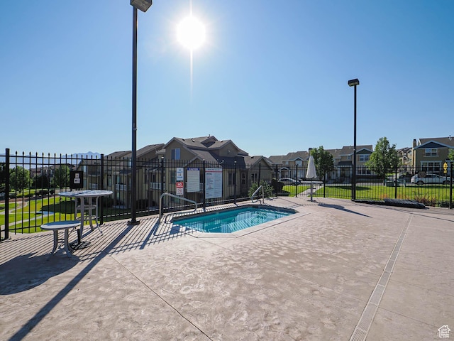 5229 W Armada Way, Herriman, UT 84096 - view of pool with a residential view, a swimming pool, and a patio