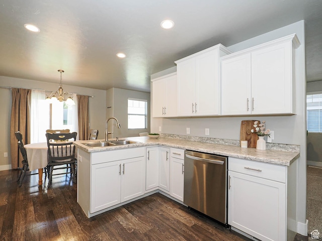 5229 W Armada Way, Herriman, UT 84096 - kitchen with stainless steel dishwasher, a chandelier, a peninsula, white cabinetry, and dark wood finished floors