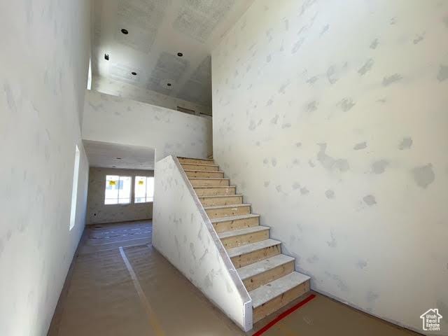 462 W Sapphire Dr Unit 7016, Tooele, UT 84074 - stairs featuring a high ceiling