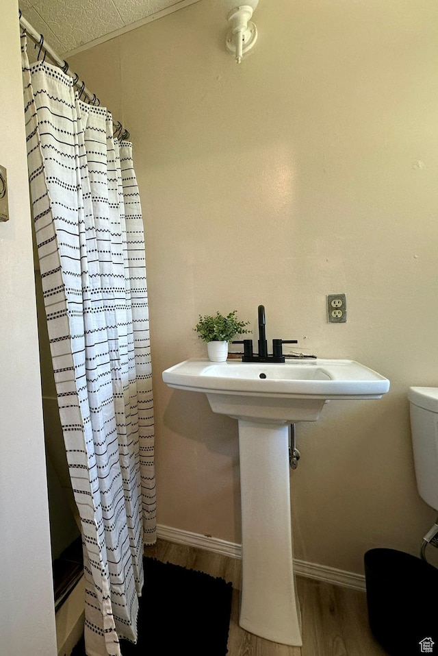 8744 E 6500 S, Jensen, UT 84035 - full bath featuring wood finished floors and curtained shower