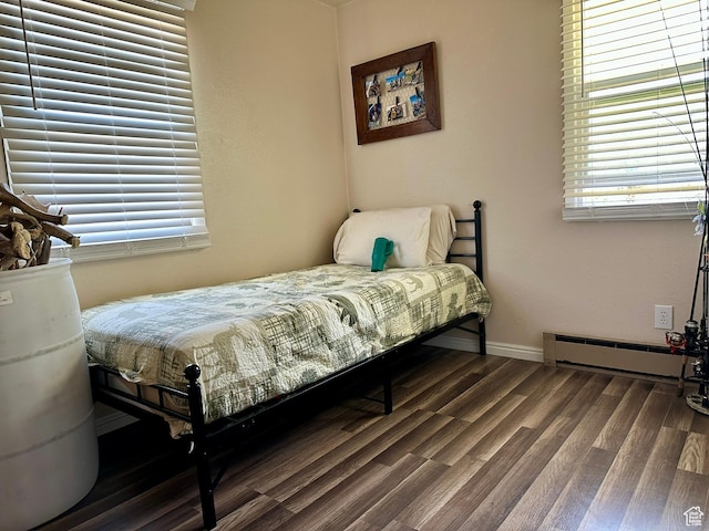 8744 E 6500 S, Jensen, UT 84035 - bedroom with a baseboard heating unit and wood finished floors