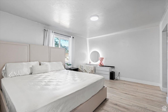 4706 W Roundtable Rd S, West Valley City, UT 84120 - bedroom featuring light wood finished floors and baseboards