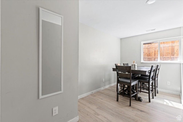 4706 W Roundtable Rd S, West Valley City, UT 84120 - dining area with wood finished floors and baseboards