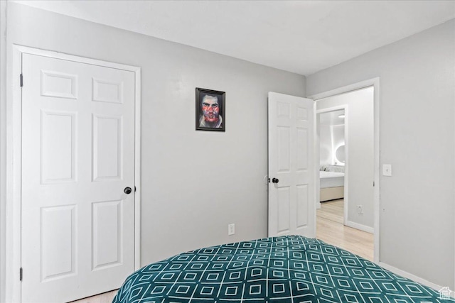 4706 W Roundtable Rd S, West Valley City, UT 84120 - bedroom with light wood-style floors and baseboards