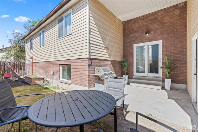 4706 W Roundtable Rd S, West Valley City, UT 84120 - view of patio / terrace featuring french doors, outdoor dining space, and area for grilling