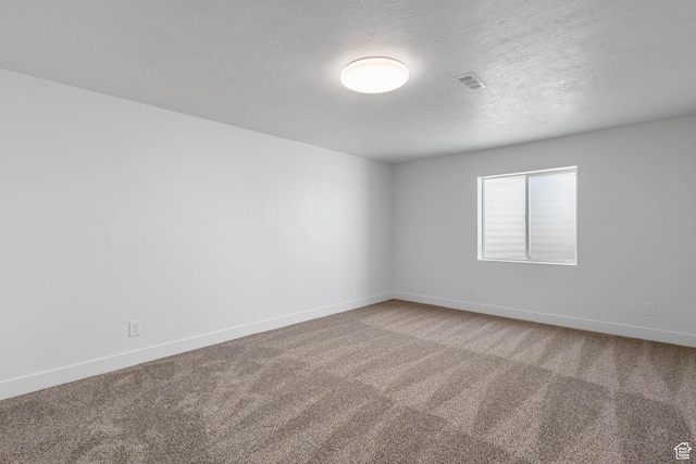 406 Zachary Way, Grantsville, UT 84029 - carpeted empty room with a textured ceiling