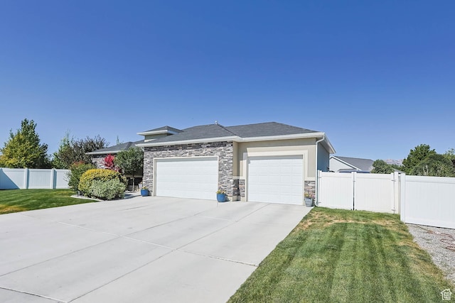 406 Zachary Way, Grantsville, UT 84029 - prairie-style home featuring a garage, concrete driveway, and stone siding