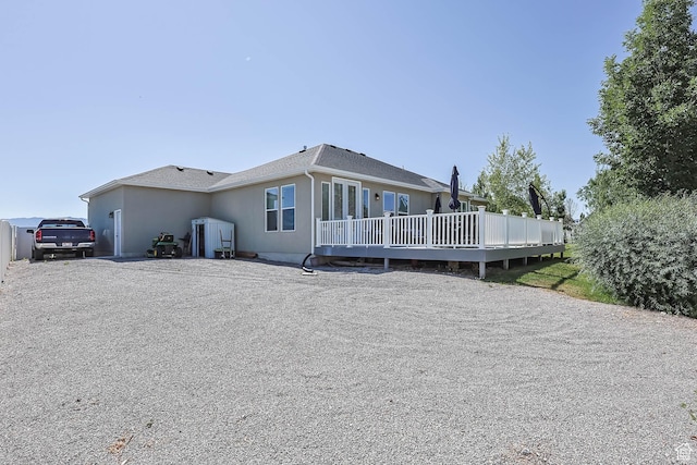 406 Zachary Way, Grantsville, UT 84029 - back of house with stucco siding and a deck