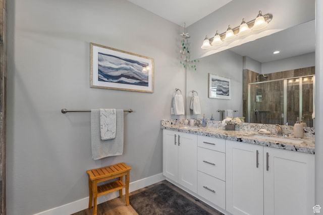 406 Zachary Way, Grantsville, UT 84029 - full bath with double vanity, a shower stall, and wood finished floors
