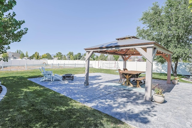 406 Zachary Way, Grantsville, UT 84029 - fenced backyard with a fire pit, a gazebo, and a patio