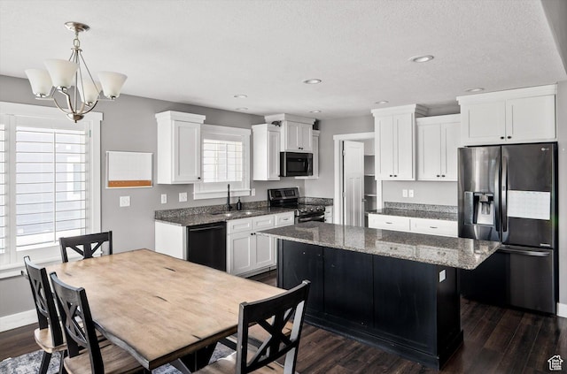4449 W 5325 S, Hooper, UT 84315 - kitchen featuring black appliances, a center island, dark wood-type flooring, white cabinetry, and recessed lighting