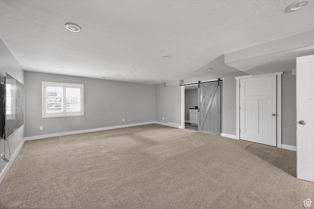 4449 W 5325 S, Hooper, UT 84315 - below grade area featuring a barn door, carpet flooring, a textured ceiling, and recessed lighting
