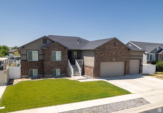 4449 W 5325 S, Hooper, UT 84315 - ranch-style house with a garage, brick siding, driveway, and stucco siding