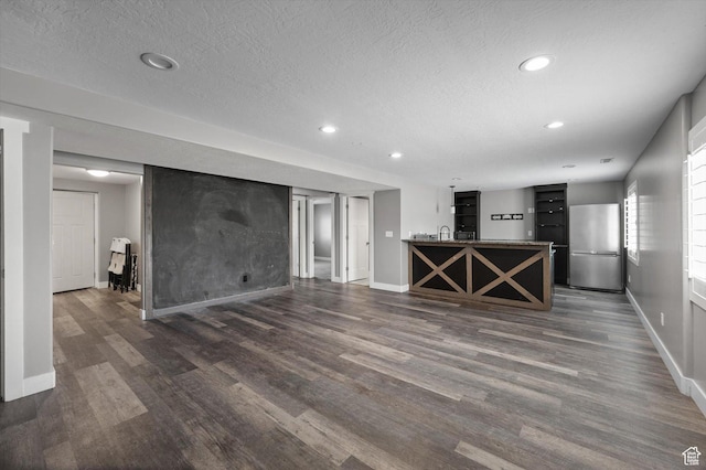 4449 W 5325 S, Hooper, UT 84315 - unfurnished living room with recessed lighting, dark wood-style flooring, and a textured ceiling