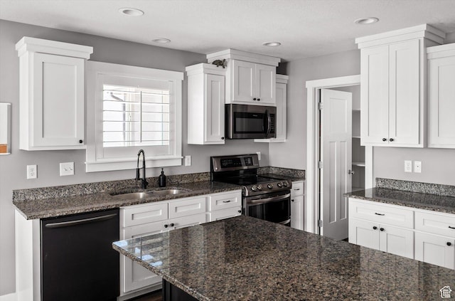 4449 W 5325 S, Hooper, UT 84315 - kitchen featuring appliances with stainless steel finishes, white cabinetry, dark stone counters, and recessed lighting