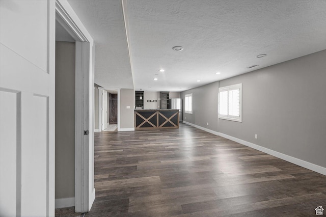 4449 W 5325 S, Hooper, UT 84315 - spare room featuring a textured ceiling, dark wood-type flooring, and recessed lighting