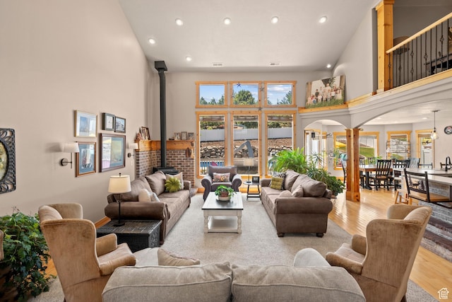 135 W Cove Dr, Elk Ridge, UT 84651 - living area with a high ceiling, recessed lighting, wood finished floors, and a wood stove