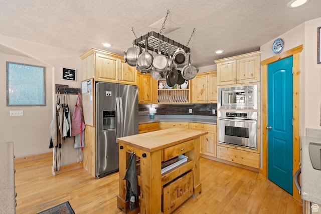 135 W Cove Dr, Elk Ridge, UT 84651 - kitchen with appliances with stainless steel finishes, light brown cabinetry, wood counters, light wood-type flooring, and recessed lighting