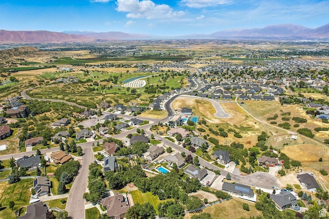 135 W Cove Dr, Elk Ridge, UT 84651 - aerial overview of property's location featuring a mountainous background and nearby suburban area