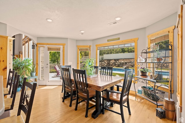 135 W Cove Dr, Elk Ridge, UT 84651 - dining space with plenty of natural light, light wood finished floors, recessed lighting, and arched walkways