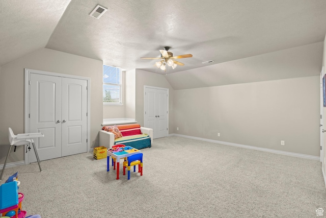 135 W Cove Dr, Elk Ridge, UT 84651 - rec room featuring vaulted ceiling, carpet floors, a ceiling fan, and a textured ceiling