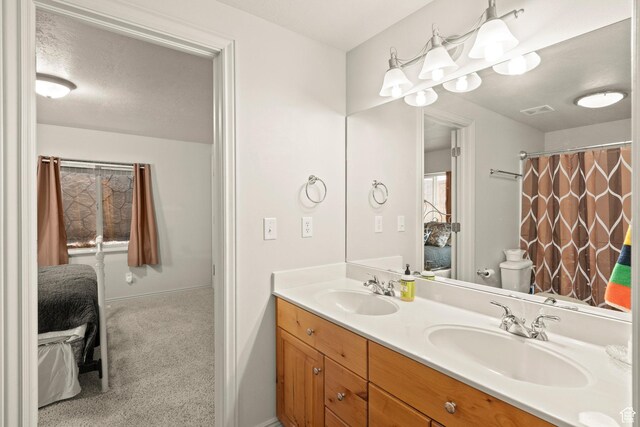 135 W Cove Dr, Elk Ridge, UT 84651 - ensuite bathroom with double vanity and toilet