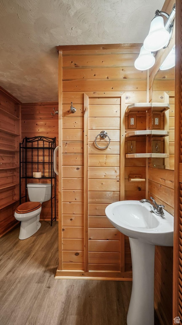 403 E Center, Nephi, UT 84648 - bathroom featuring wood finished floors and wooden walls