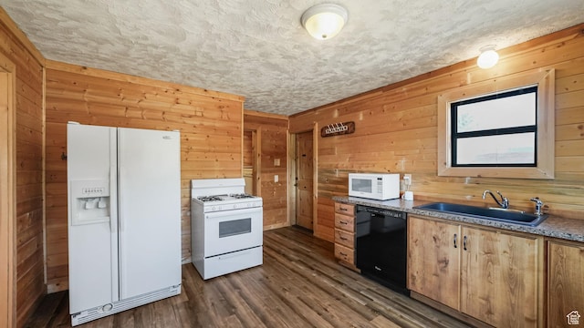403 E Center, Nephi, UT 84648 - kitchen featuring white appliances, wooden walls, dark wood-style flooring, and a textured ceiling