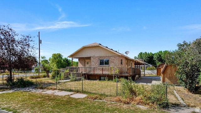 403 E Center, Nephi, UT 84648 - back of property featuring a wooden deck and brick siding