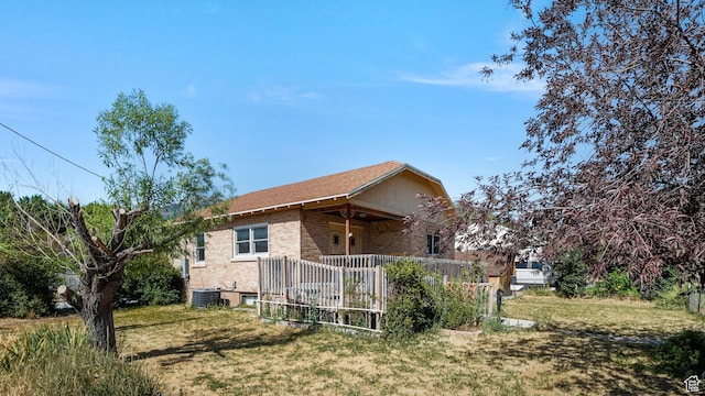 403 E Center, Nephi, UT 84648 - back of house with brick siding, covered porch, and a lawn