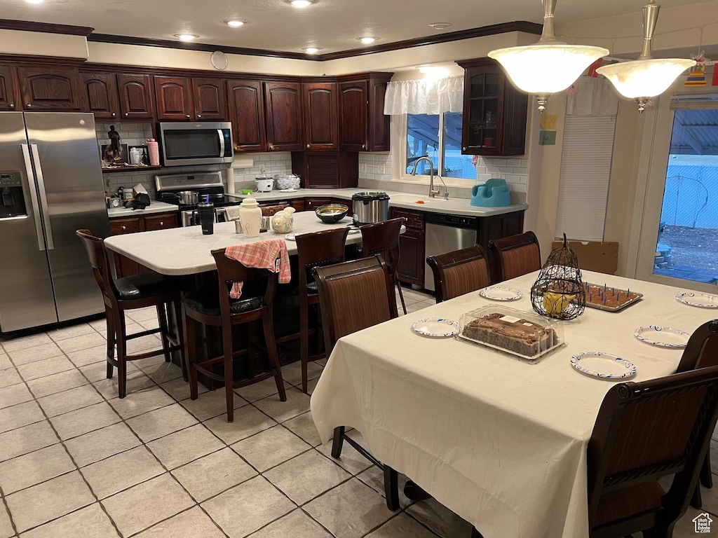 1463 W 730 S, Orem, UT 84058 - dining room featuring light tile patterned floors and crown molding