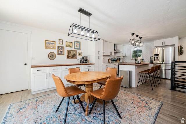 2127 E 5950 N, Liberty, UT 84310 - dining space featuring light wood-style flooring and a chandelier