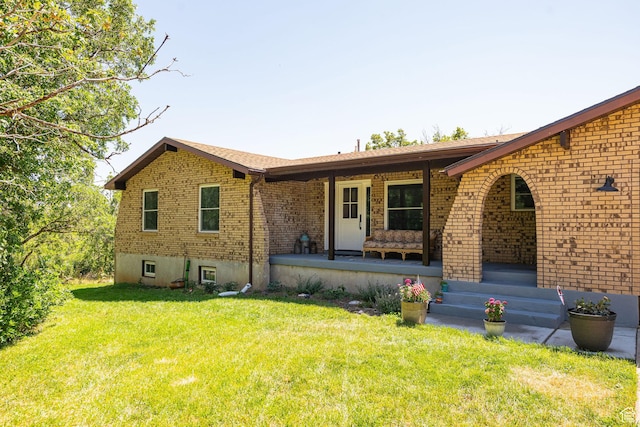 2127 E 5950 N, Liberty, UT 84310 - view of front of house featuring brick siding, covered porch, and a front yard