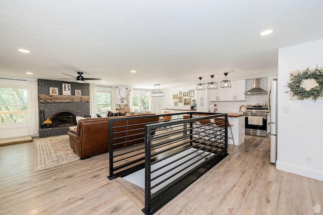 2127 E 5950 N, Liberty, UT 84310 - living area with a ceiling fan, light wood-style flooring, recessed lighting, and a brick fireplace