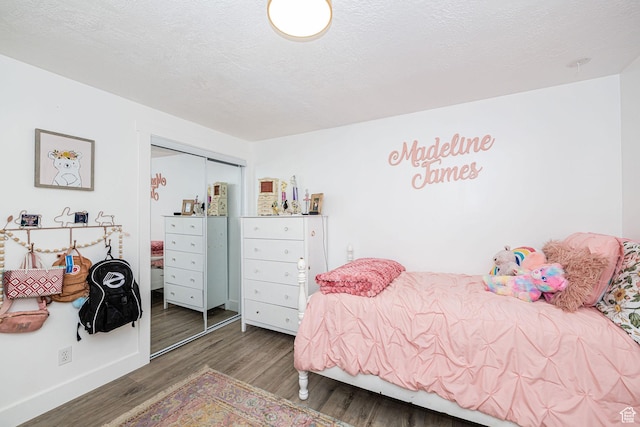 2127 E 5950 N, Liberty, UT 84310 - bedroom featuring wood finished floors, a closet, and a textured ceiling