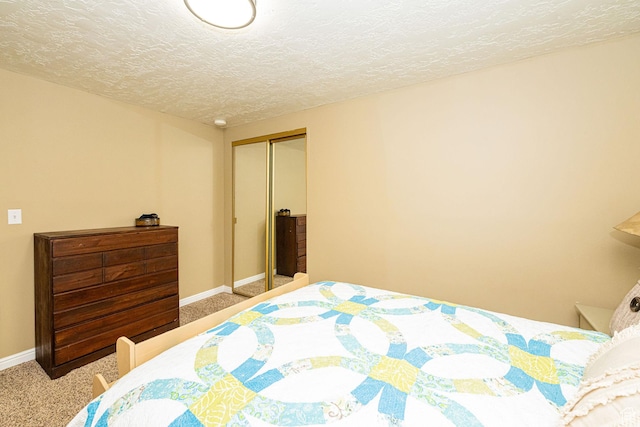 2127 E 5950 N, Liberty, UT 84310 - carpeted bedroom featuring a closet and a textured ceiling